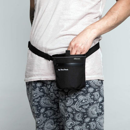 Person wearing a black waist bag with 'The Great Pumpkin' branding on a plain background