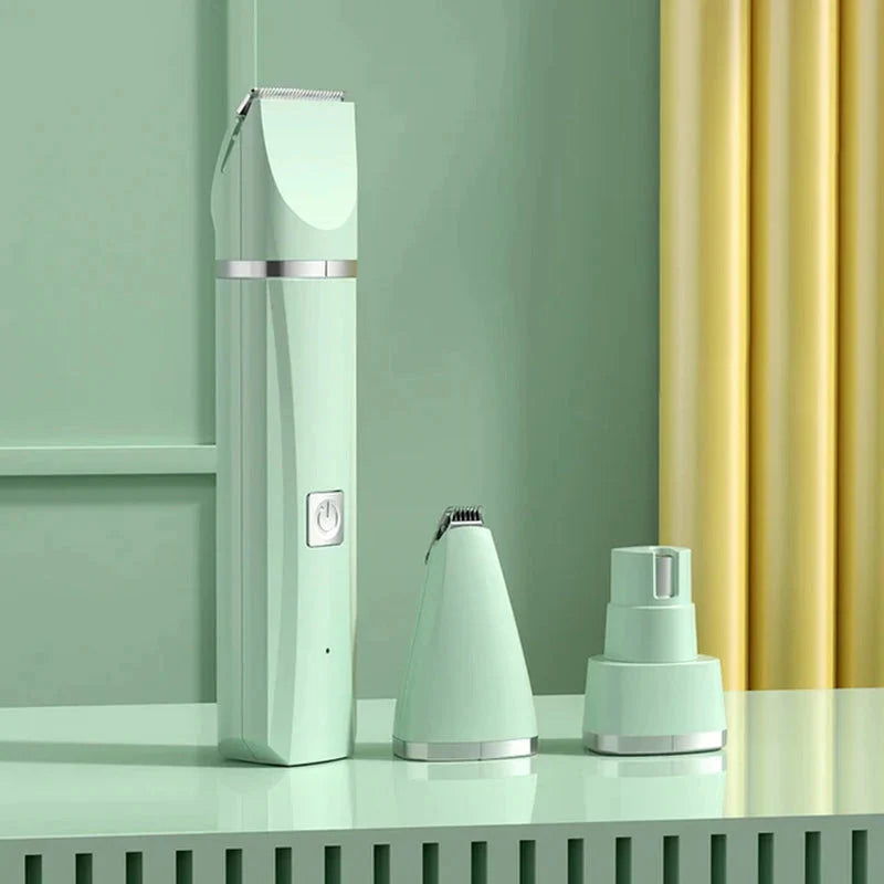 Set of grooming tools including a hair clipper and two attachments on a green surface with a yellow curtain in the background.