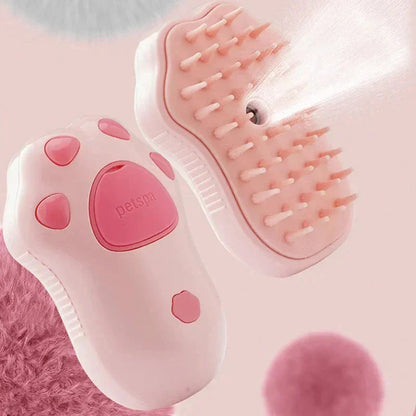 Pink pet grooming brush with paw design on a pink background