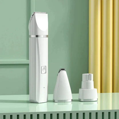 White grooming device with attachments on a green surface