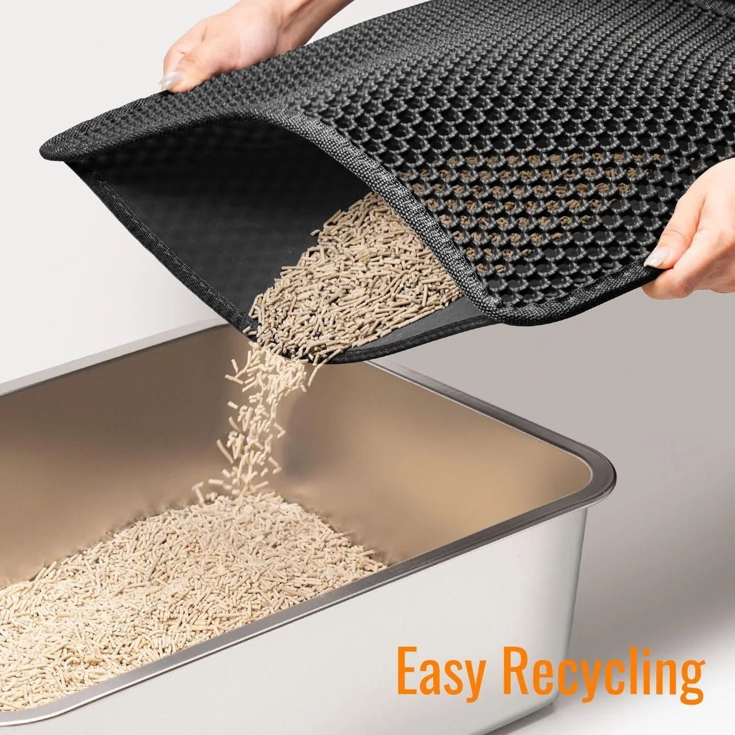 Cat litter scoop being used to empty cat litter into a container with 'Easy Recycling' text.